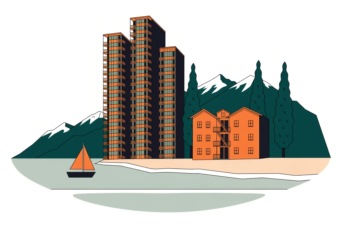 Residential towers and a wooden walk-up in Vancouver, with mountains behind and a sailboat on the water.